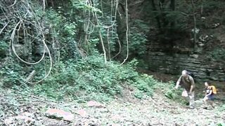 Naughty teen gets fucked by a mature guide in the woods